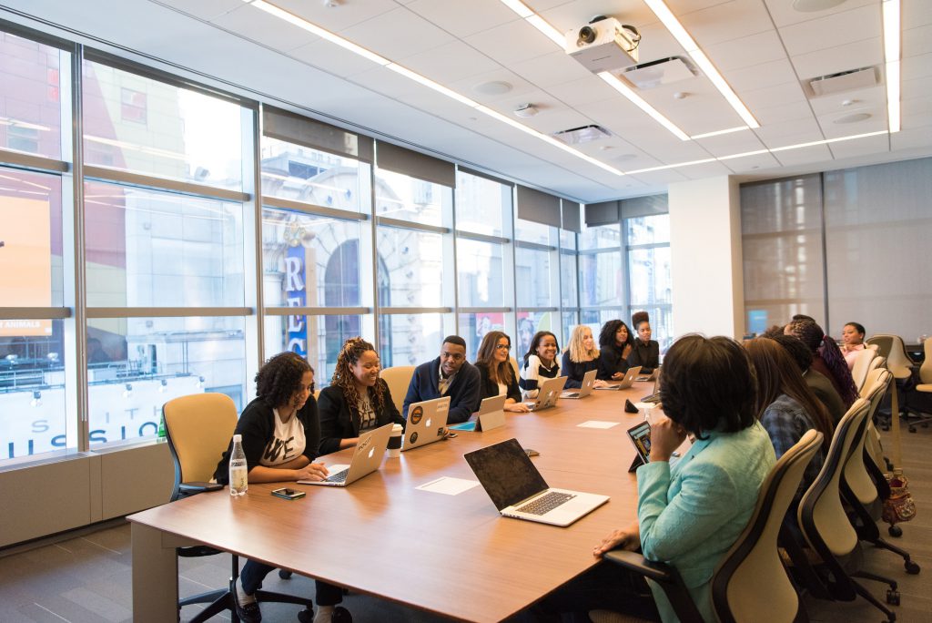 A team meet in a conference room