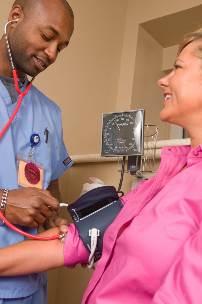 A doctor checking BP